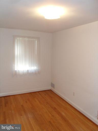 2239 Firethorn Road Middle River, MD 21220 - Photo 2 of 21 wooden floor in an empty room