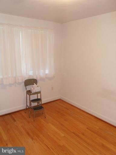 2239 Firethorn Road Middle River, MD 21220 - Photo 15 of 21 a view of a room with a wooden bench and a window