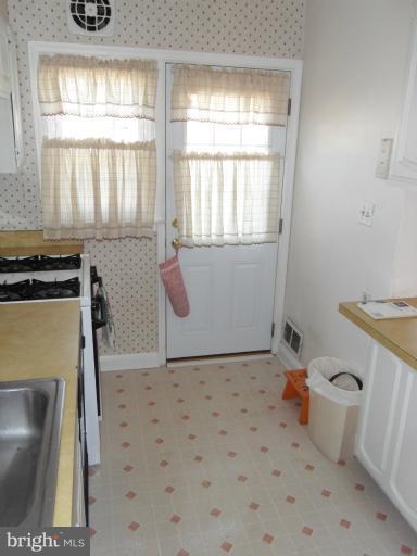 2239 Firethorn Road Middle River, MD 21220 - Photo 6 of 21 a bathroom with a sink a toilet and window