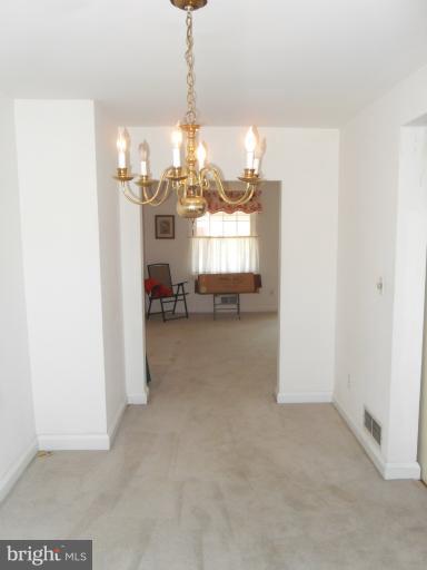 2239 Firethorn Road Middle River, MD 21220 - Photo 8 of 21 a view of a room with a chandelier