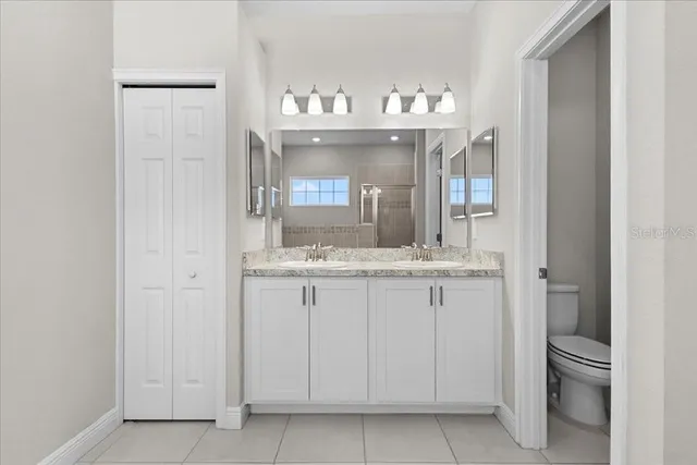 a living room with furniture and painting on the wall