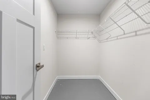 a view of a room with racks on the wall