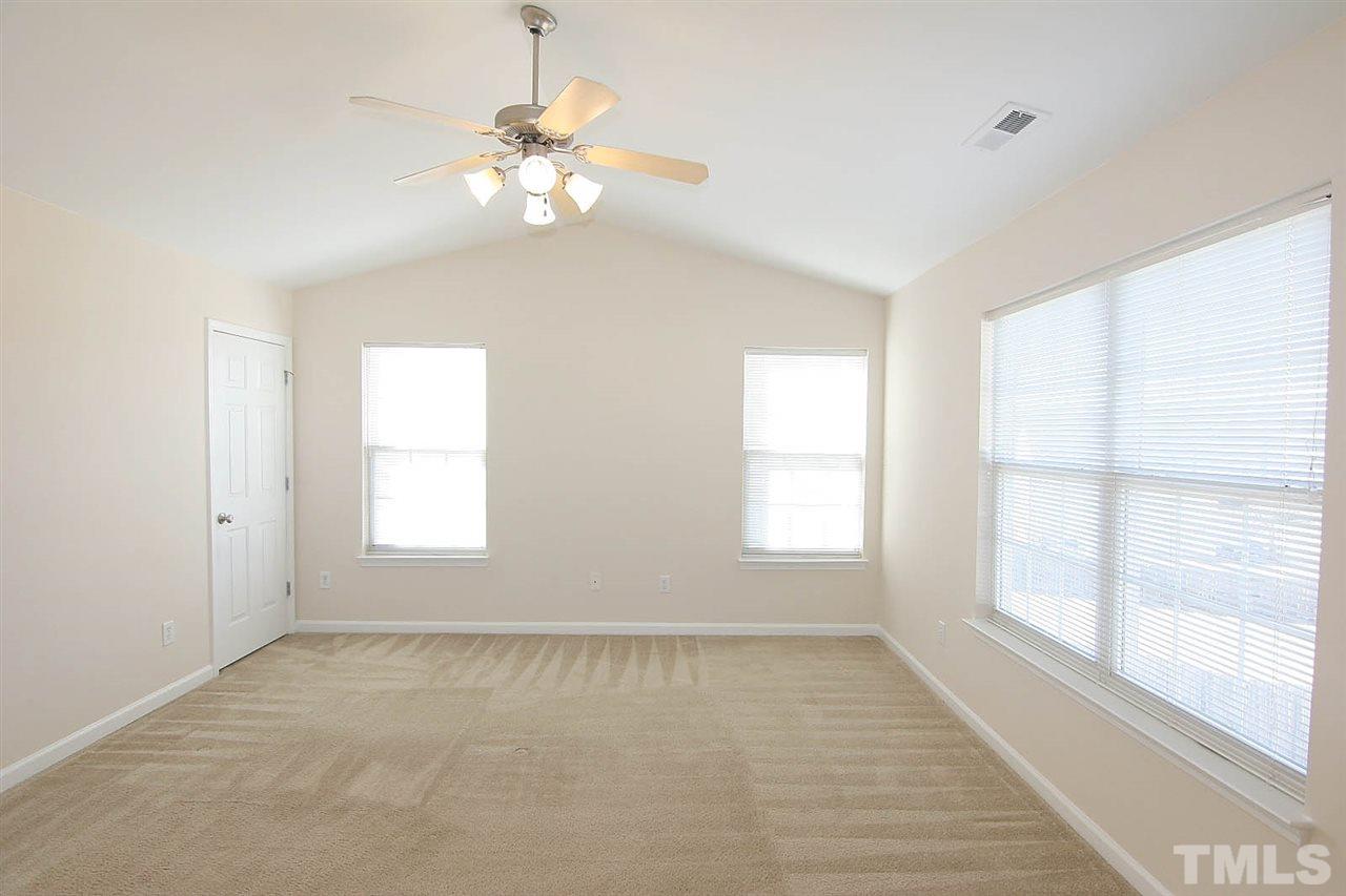7009 Spanglers Spring Way Raleigh, NC 27610 - Photo 14 of 25 a view of an empty room with a window