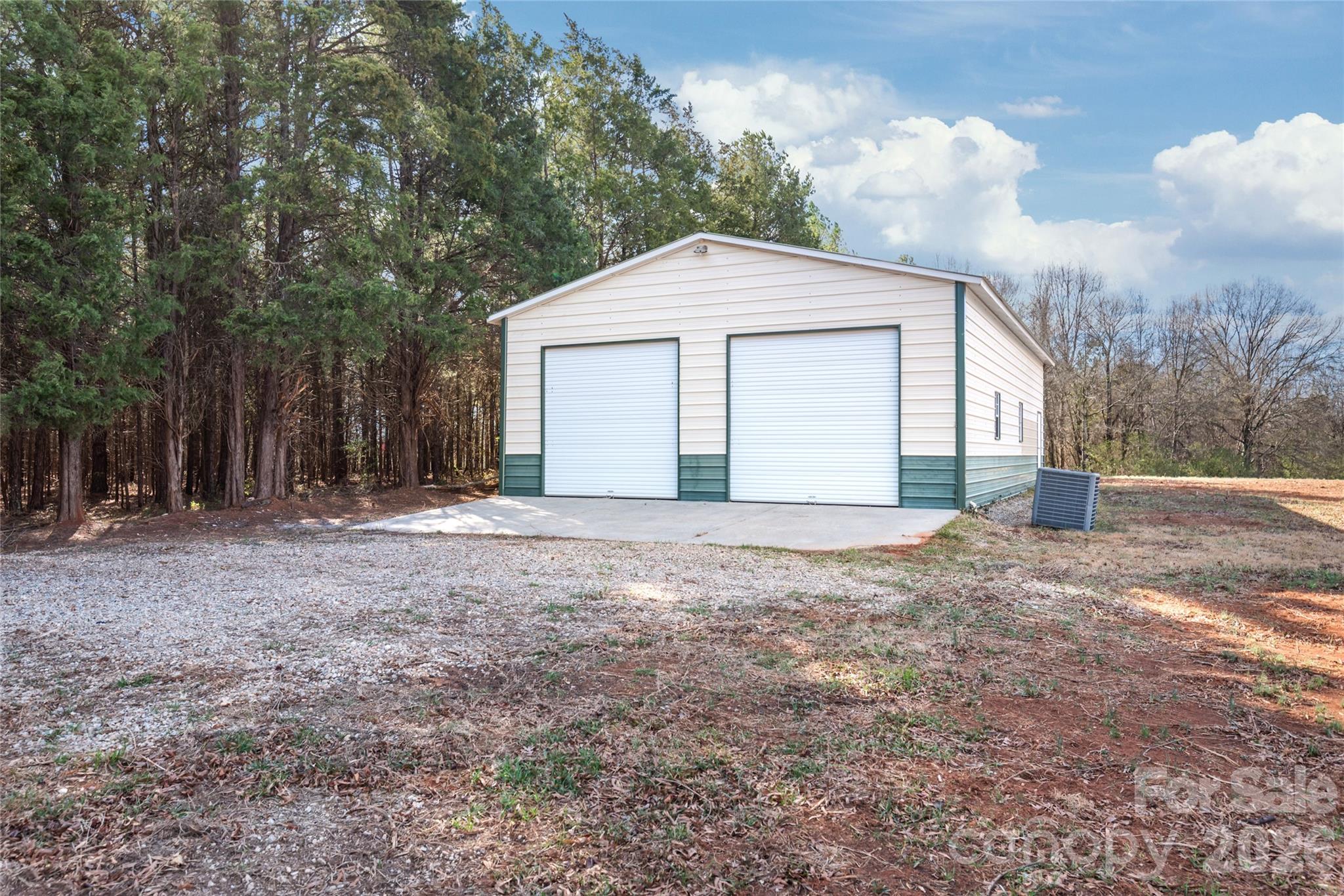 11956 Sam Black Road Midland, NC 28107 - Photo 19 of 23 a view of backyard of house with large trees