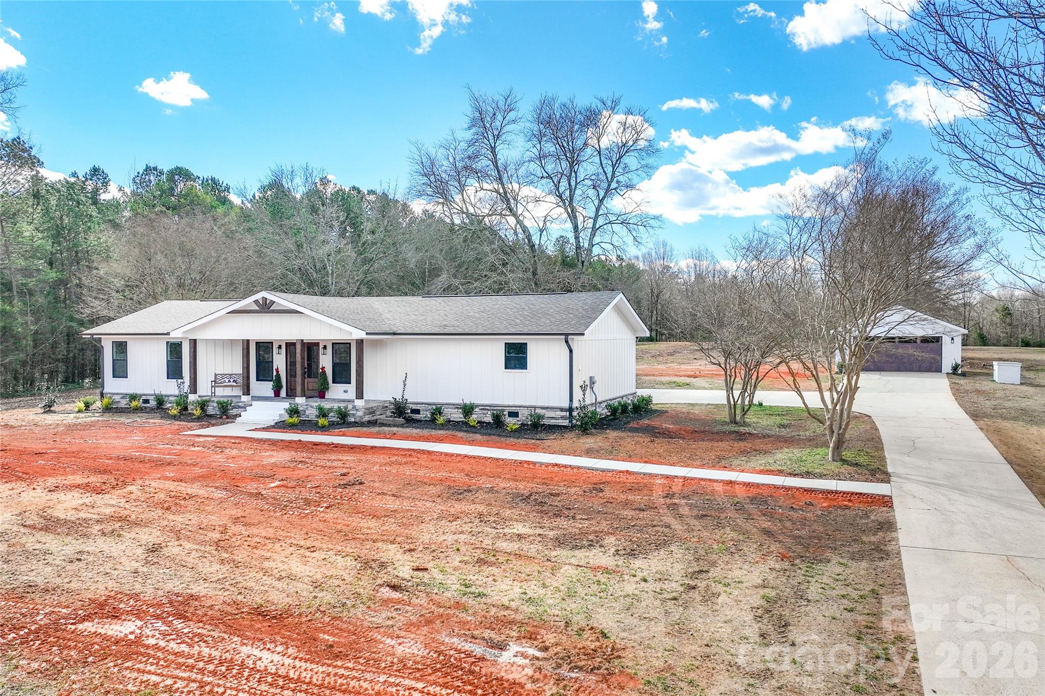 11956 Sam Black Road Midland, NC 28107 - Photo 21 of 23 a view of a house with a yard