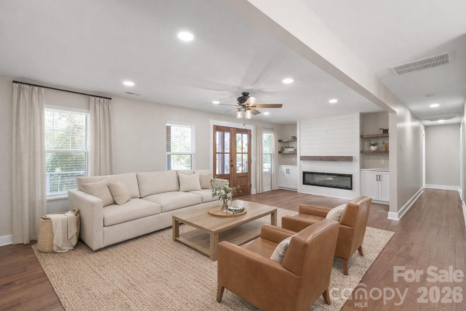 11956 Sam Black Road Midland, NC 28107 - Photo 3 of 23 a living room with fireplace furniture and a large window