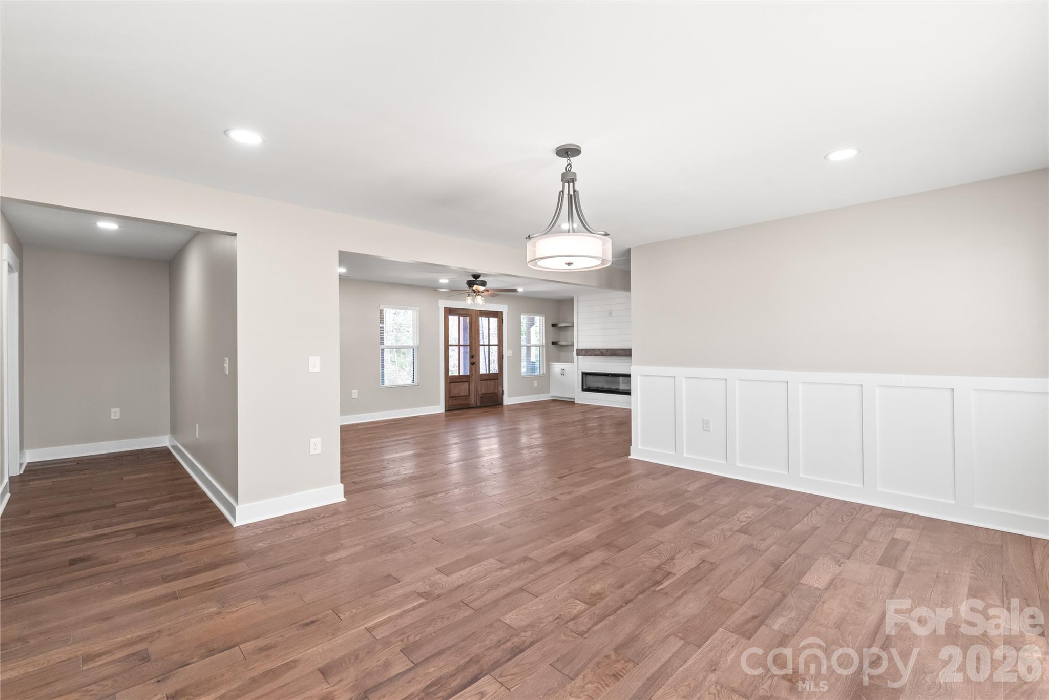 11956 Sam Black Road Midland, NC 28107 - Photo 8 of 23 a view of livingroom with hardwood floor and a ceiling fan