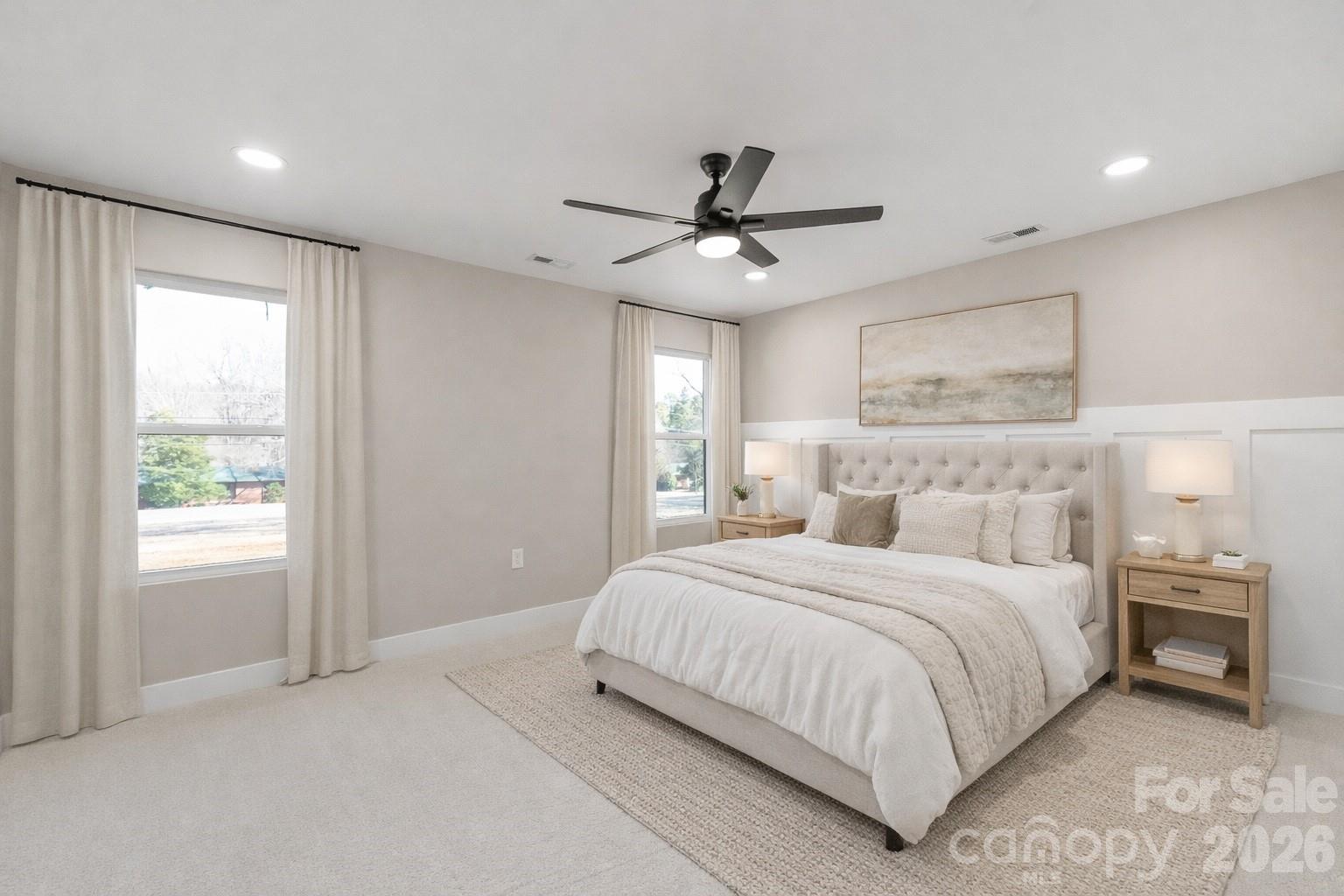 11956 Sam Black Road Midland, NC 28107 - Photo 9 of 23 a bedroom with a large bed and a chandelier
