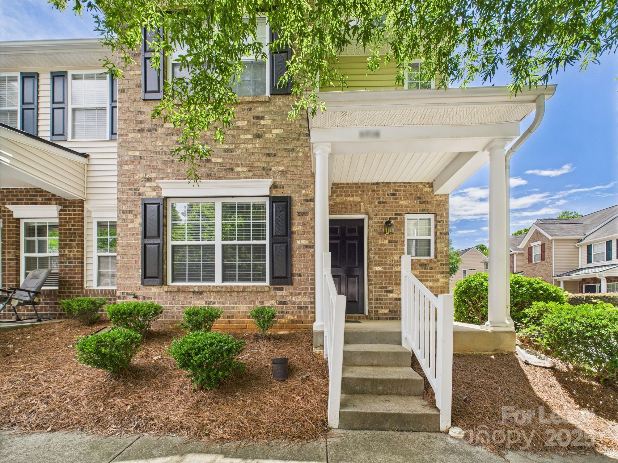 5706 Bent Creek Circle Charlotte, NC 28227 - Photo 2 of 13 a front view of a house with a garden