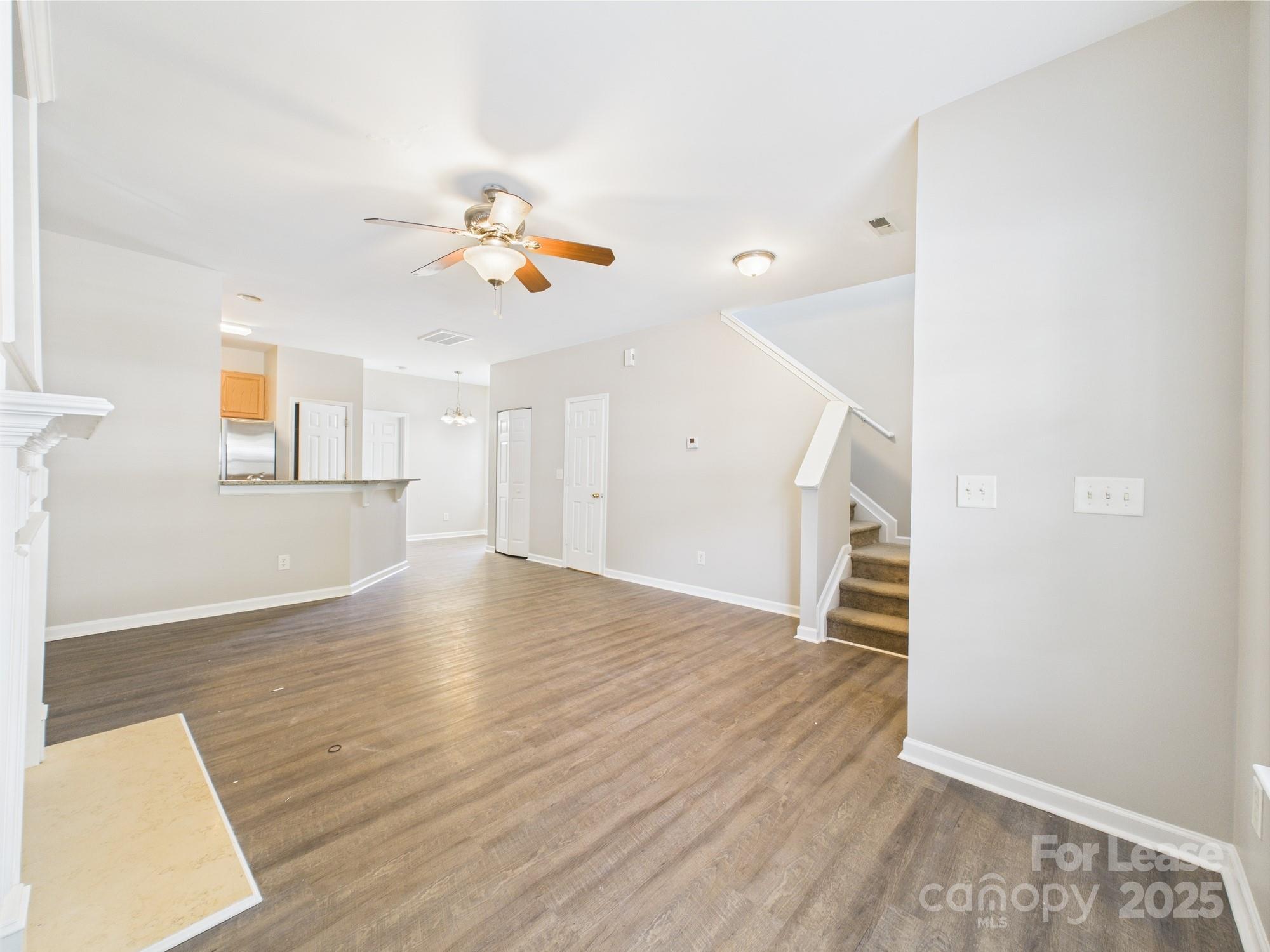 5706 Bent Creek Circle Charlotte, NC 28227 - Photo 3 of 13 a view of an empty room with wooden floor and a window