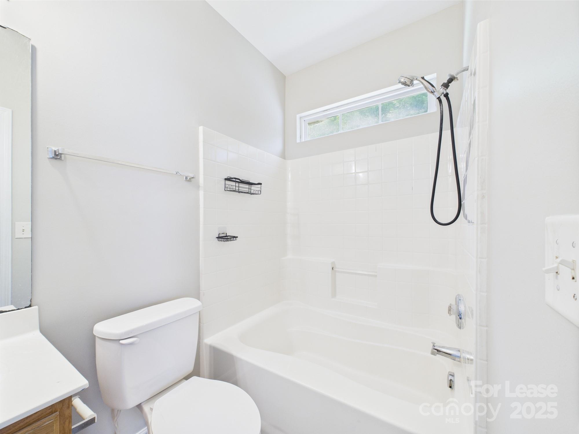 5706 Bent Creek Circle Charlotte, NC 28227 - Photo 10 of 13 a bathroom with a toilet and a shower