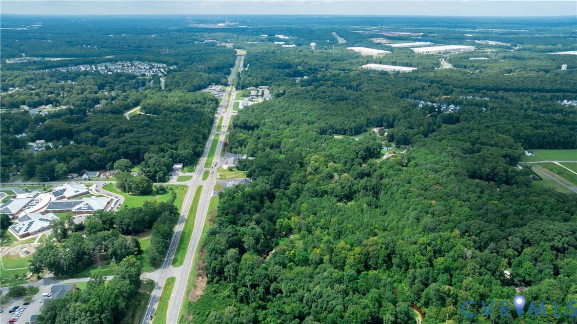 2100 East Hundred Road Chester, VA 23836 - Photo 6 of 6 an aerial view of residential houses with outdoor space and trees