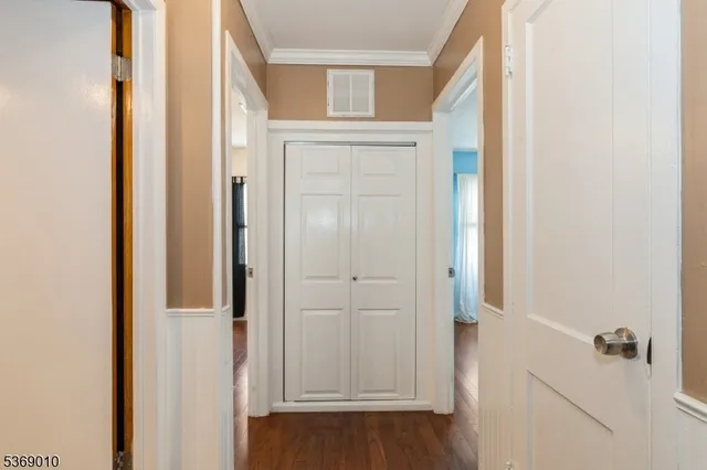 a bathroom with a toilet and a shower curtain