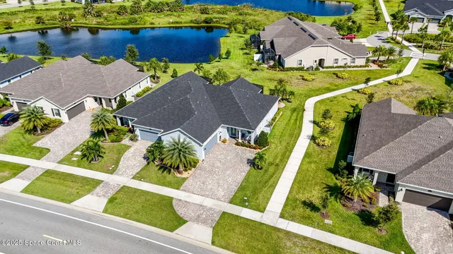 an aerial view of houses with outdoor space