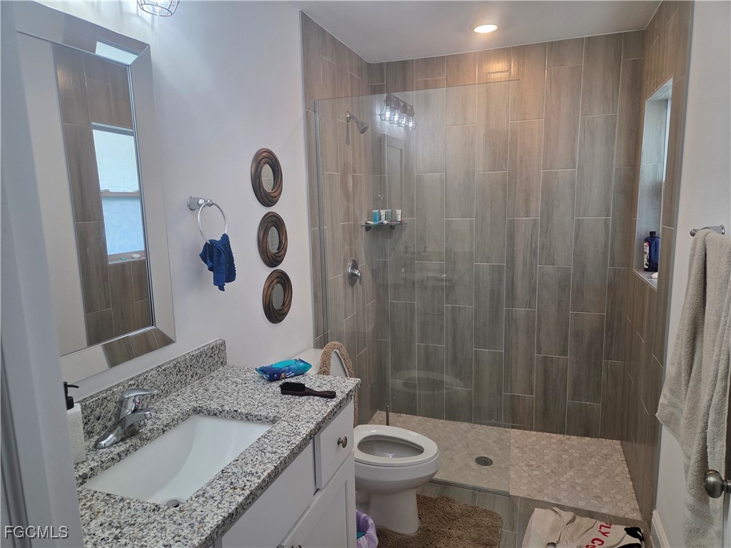 2156-2154 Edison Avenue Fort Myers, FL 33901 - Photo 17 of 38 a bathroom with a sink a toilet and shower