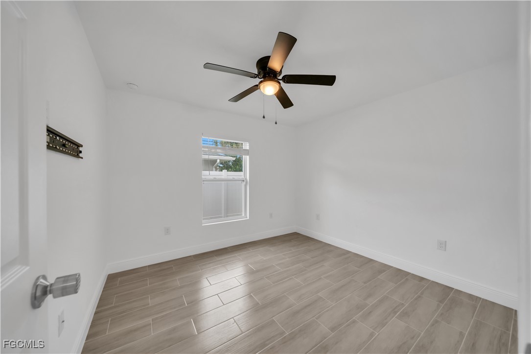 2156-2154 Edison Avenue Fort Myers, FL 33901 - Photo 24 of 38 wooden floor in an empty room