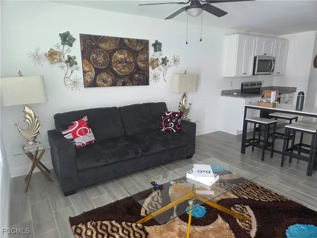 a living room with furniture and a window