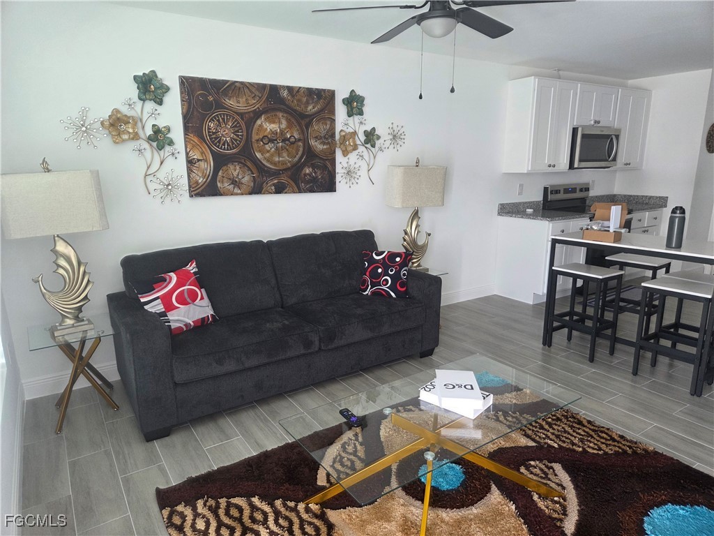 2156-2154 Edison Avenue Fort Myers, FL 33901 - Photo 5 of 38 a living room with furniture kitchen view and a dining table