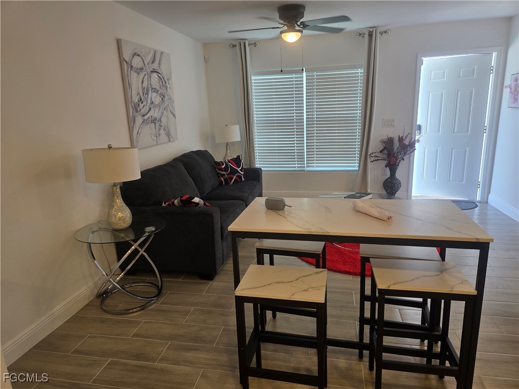 2156-2154 Edison Avenue Fort Myers, FL 33901 - Photo 6 of 38 a view of a dining room with furniture and wooden floor