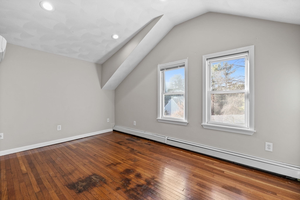 201 Water Street Saugus, MA 01906 - Photo 23 of 38 an empty room with wooden floor and windows