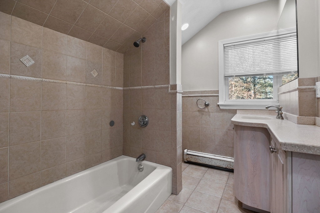 201 Water Street Saugus, MA 01906 - Photo 26 of 38 a bathroom with a tub a sink and a window