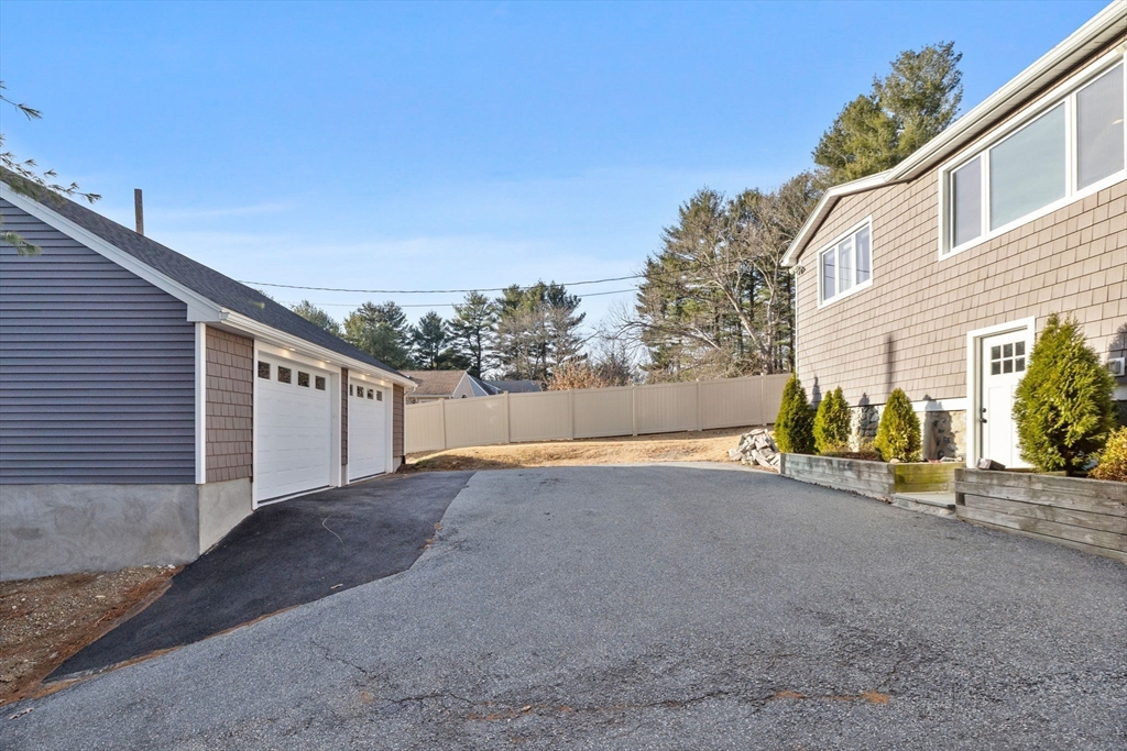 201 Water Street Saugus, MA 01906 - Photo 36 of 38 a view of a house with backyard and a garage