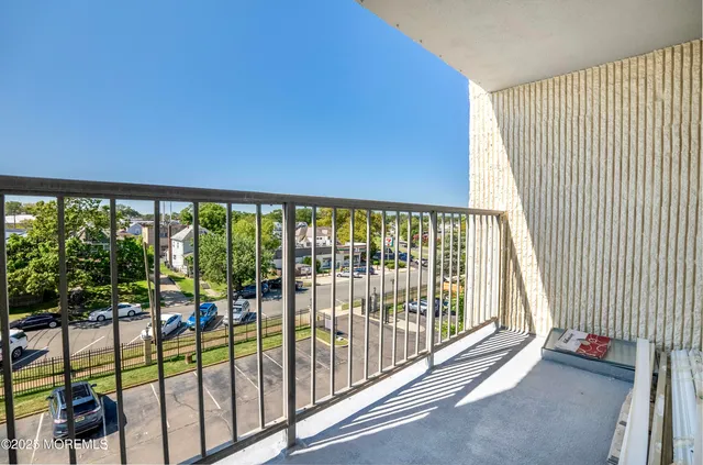 a view of a floor to ceiling window and a balcony