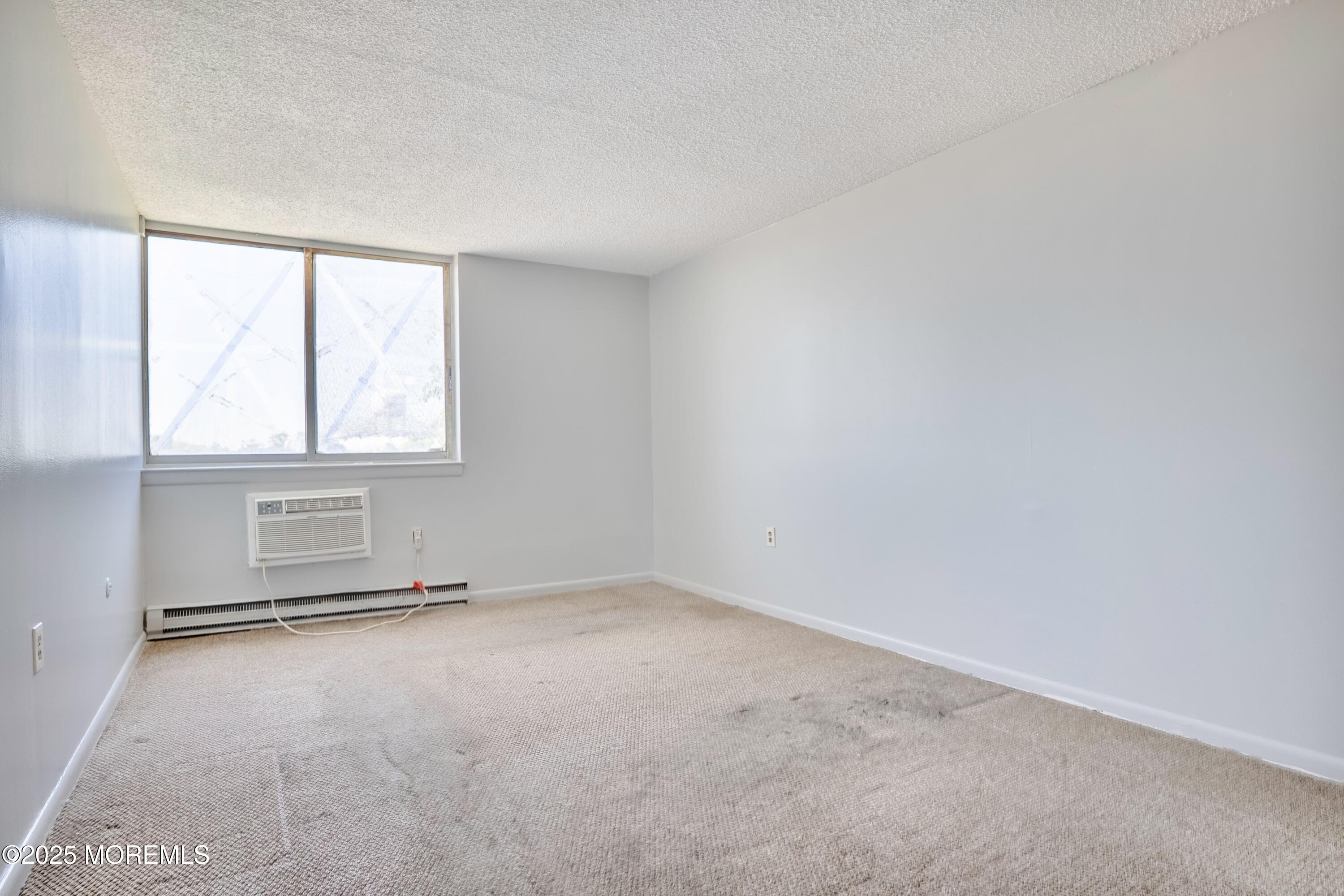 1000 River Road, Unit 4G Belmar, NJ 07719 - Photo 12 of 13 an empty room with windows