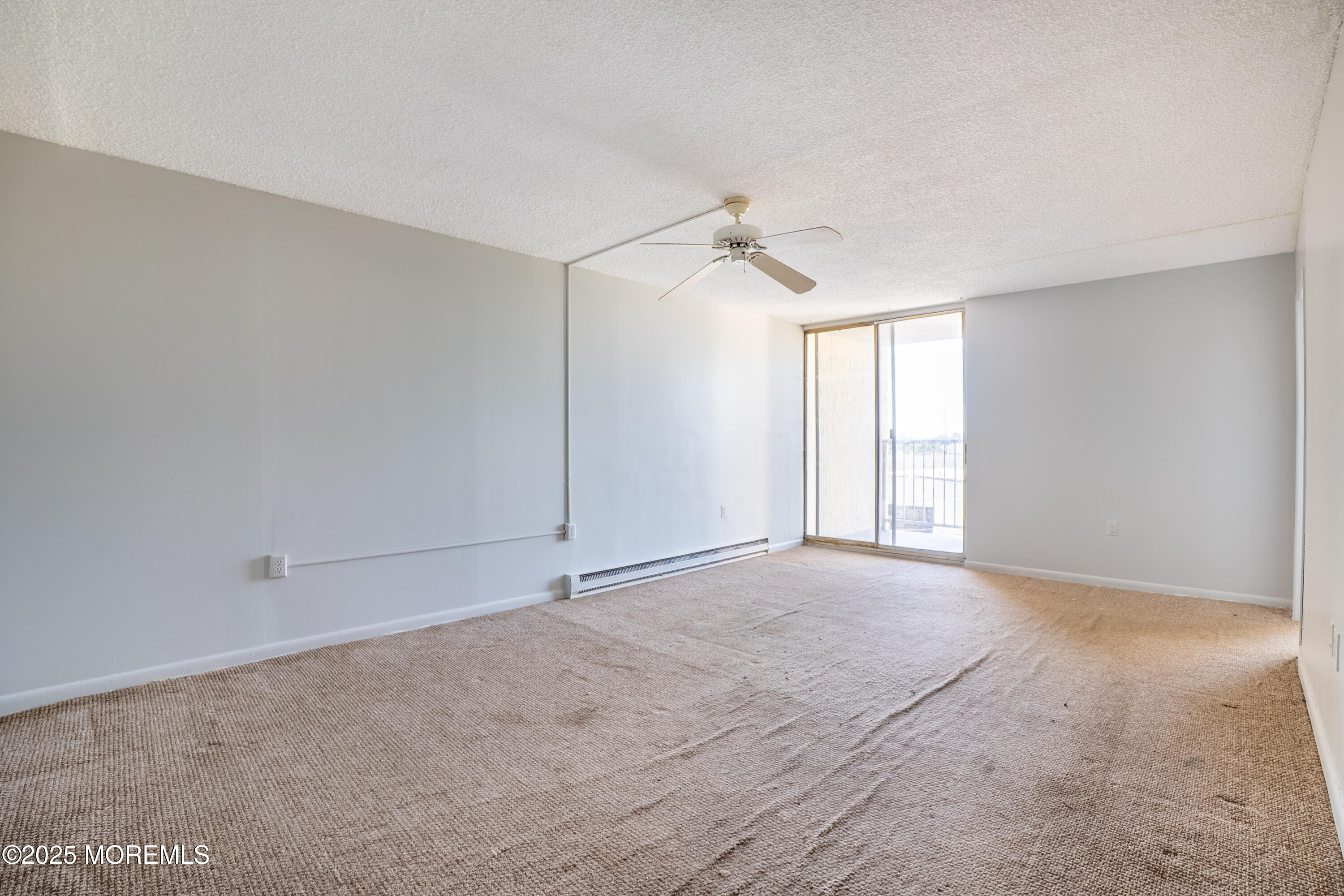 1000 River Road, Unit 4G Belmar, NJ 07719 - Photo 5 of 13 a view of an empty room with a window