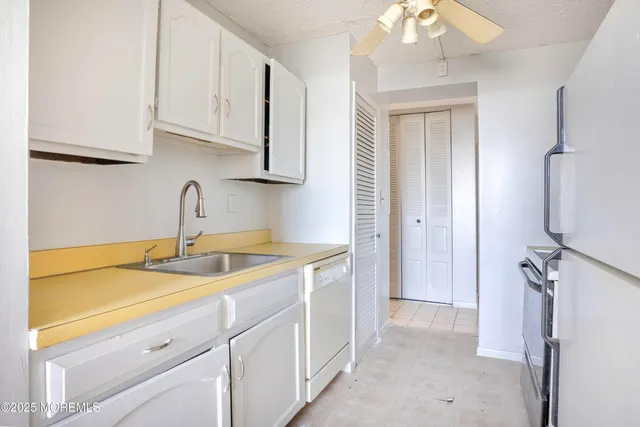 a kitchen with a sink and cabinets