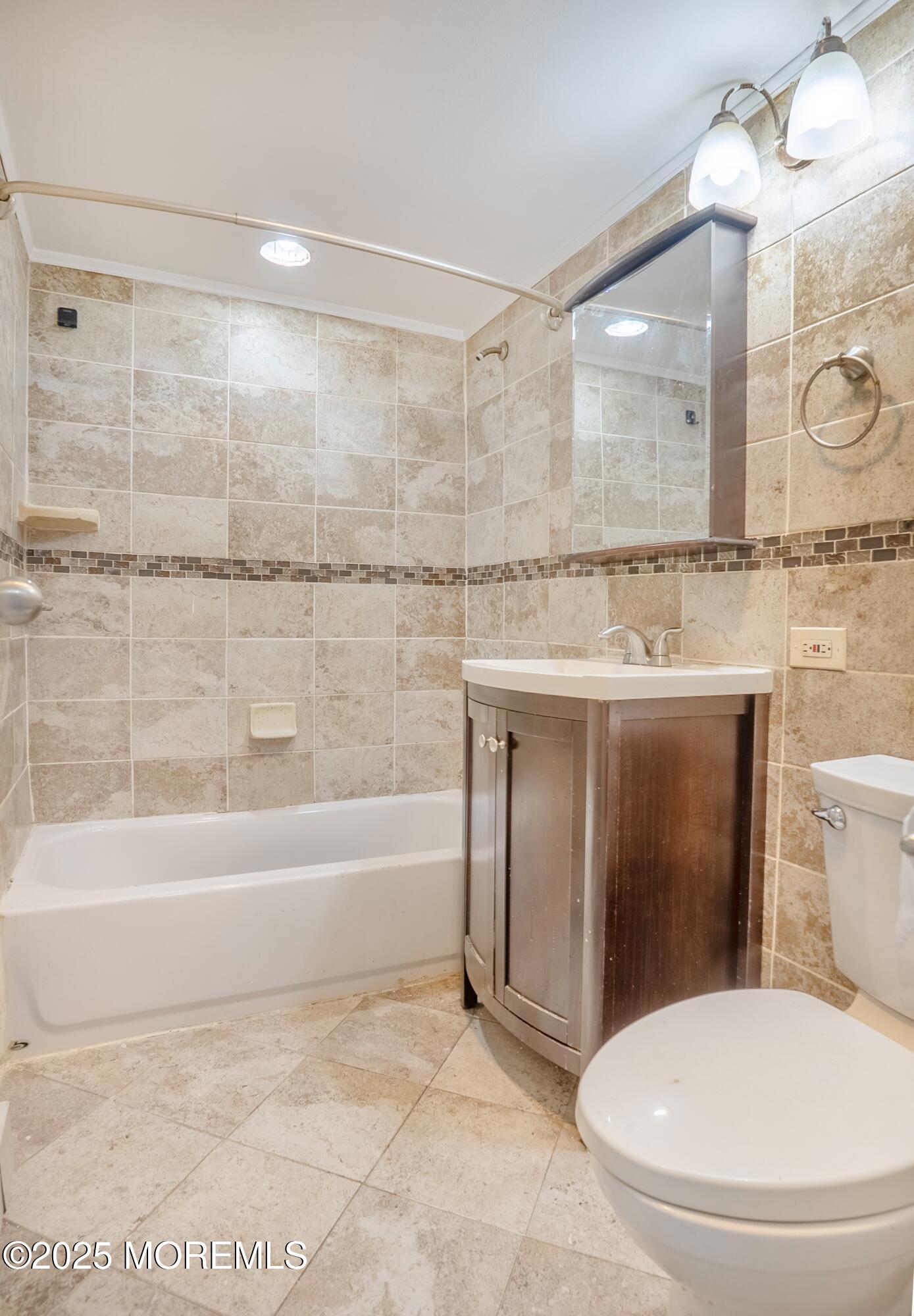 1000 River Road, Unit 4G Belmar, NJ 07719 - Photo 10 of 13 a bathroom with a sink a toilet and bathtub
