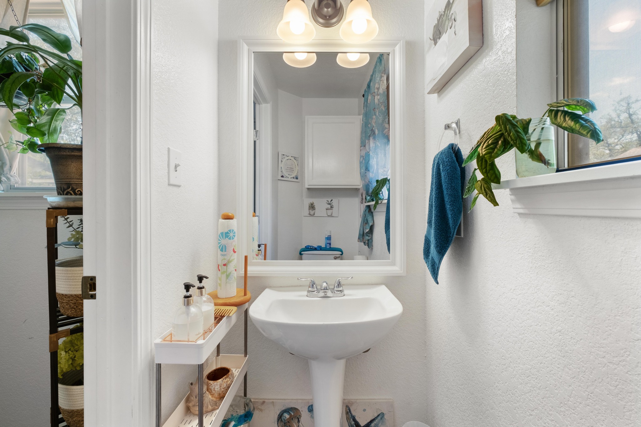 1184 Waller Street Austin, TX 78702 - Photo 7 of 19 a bathroom with a sink and a mirror