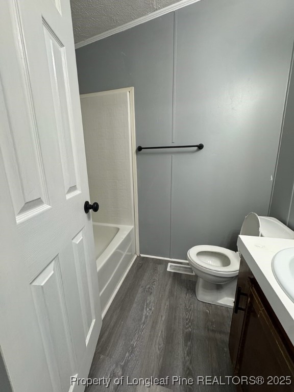 114 Oak Street Fayetteville, NC 28306 - Photo 6 of 6 a white toilet sitting next to a white sink