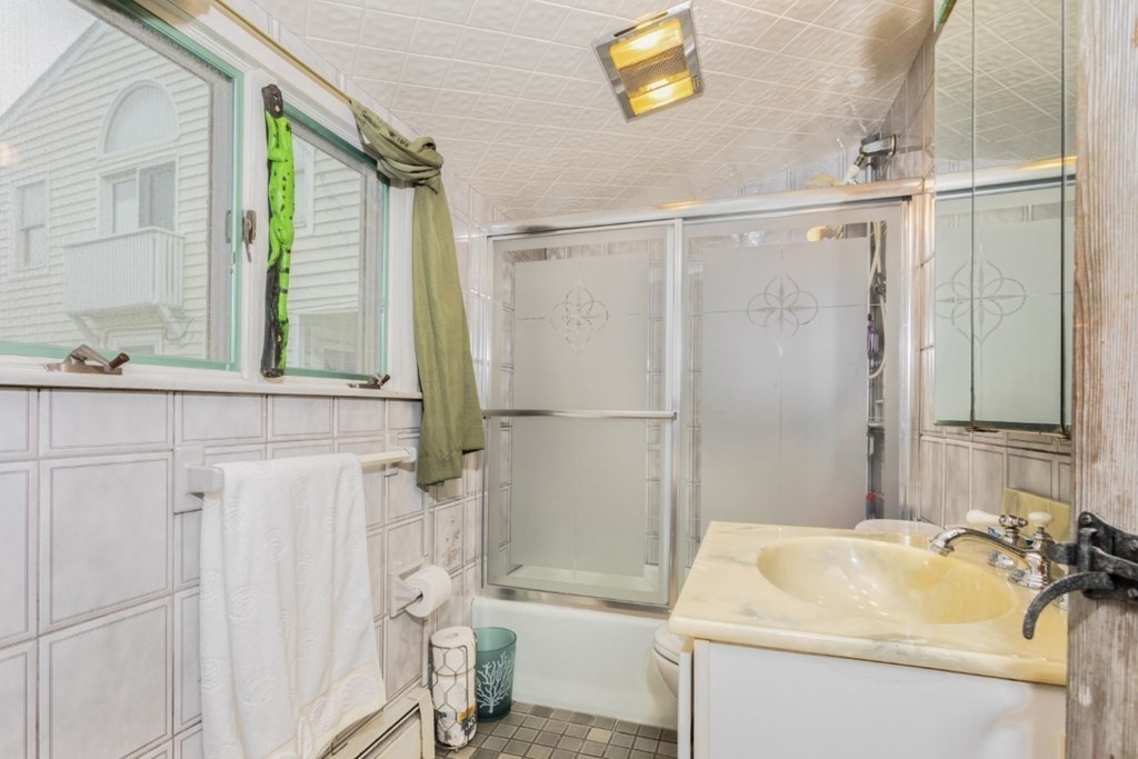 8 Castle Road Nahant, MA 01908 - Photo 13 of 32 a bathroom with a sink a toilet and shower