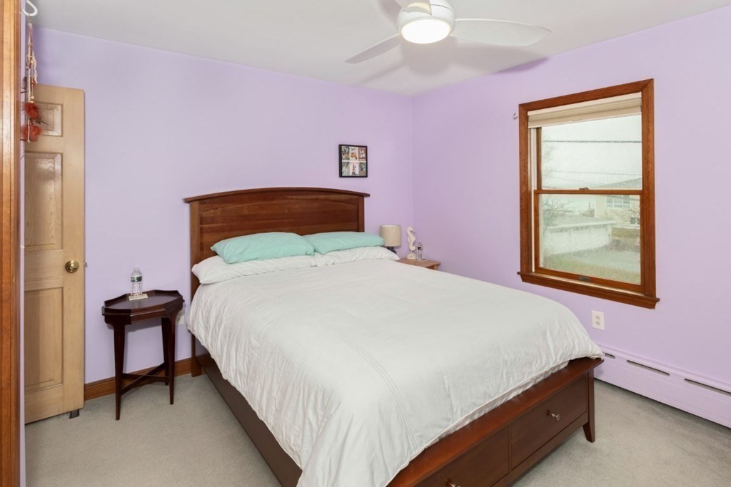 8 Castle Road Nahant, MA 01908 - Photo 14 of 32 a bedroom with a bed and a window