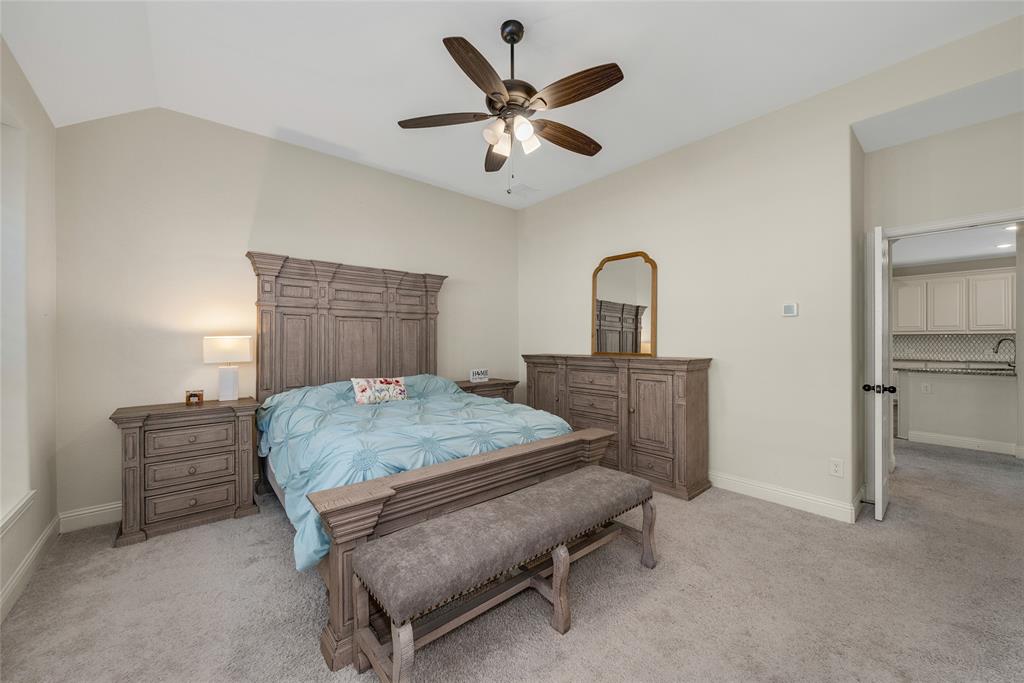 2203 Vista Ridge Road Melissa, TX 75454 - Photo 15 of 40 Bedroom featuring light colored carpet, a ceiling fan, and vaulted ceiling