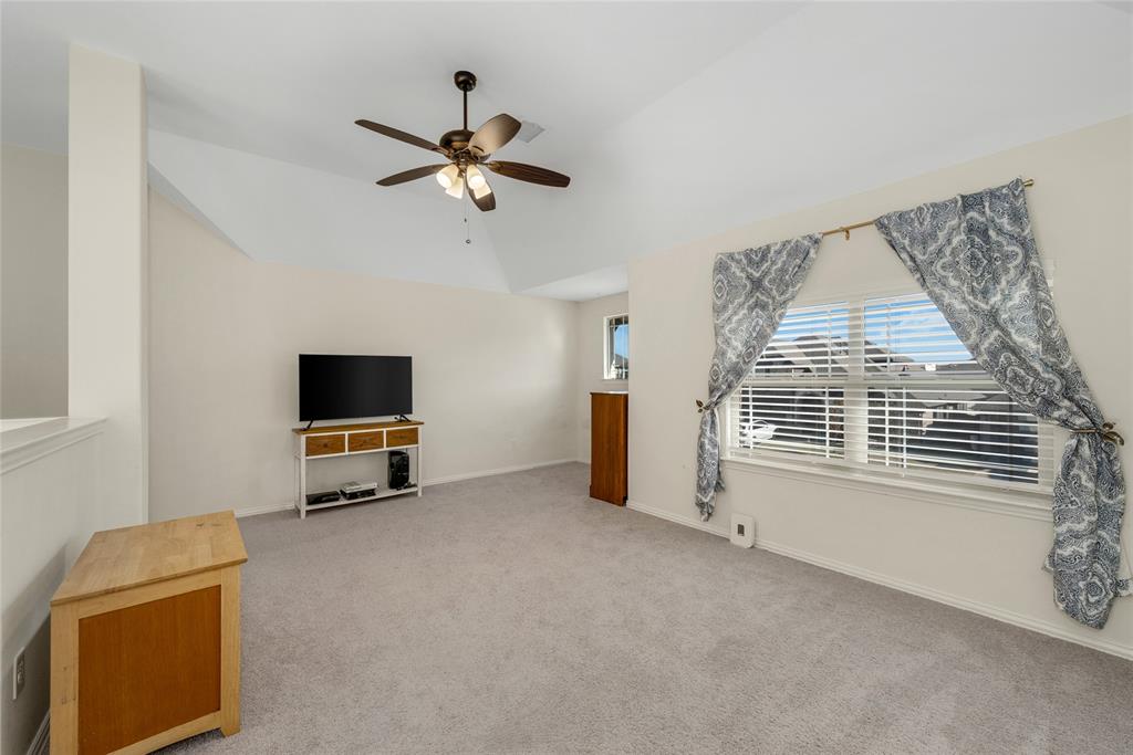 2203 Vista Ridge Road Melissa, TX 75454 - Photo 20 of 40 Unfurnished living room featuring carpet, ceiling fan, and lofted ceiling