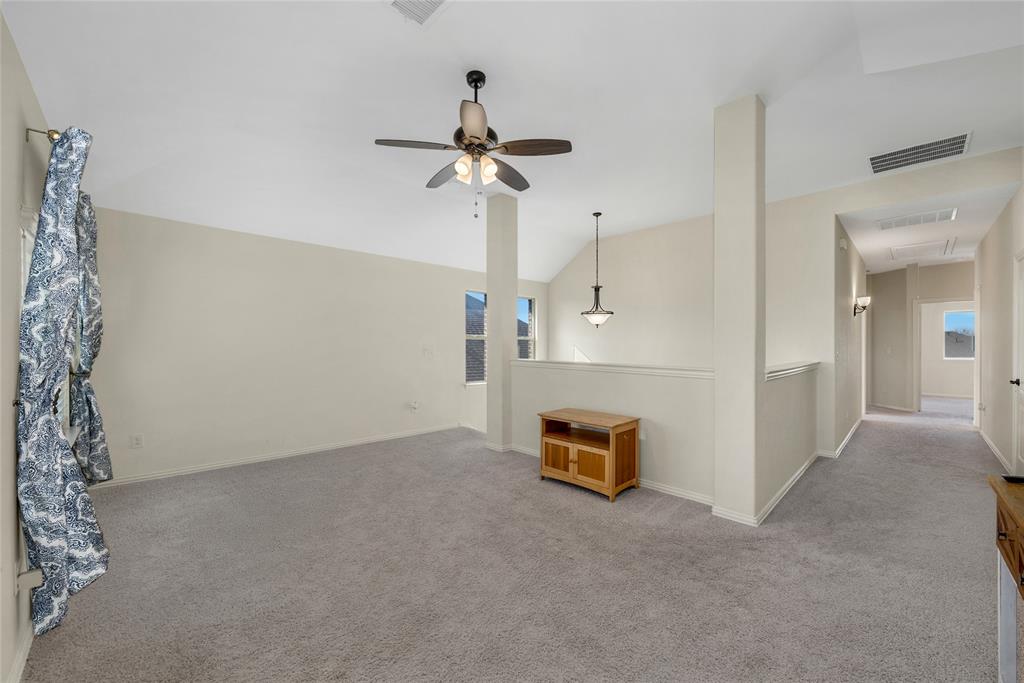 2203 Vista Ridge Road Melissa, TX 75454 - Photo 21 of 40 Unfurnished living room with carpet flooring, lofted ceiling, and ceiling fan