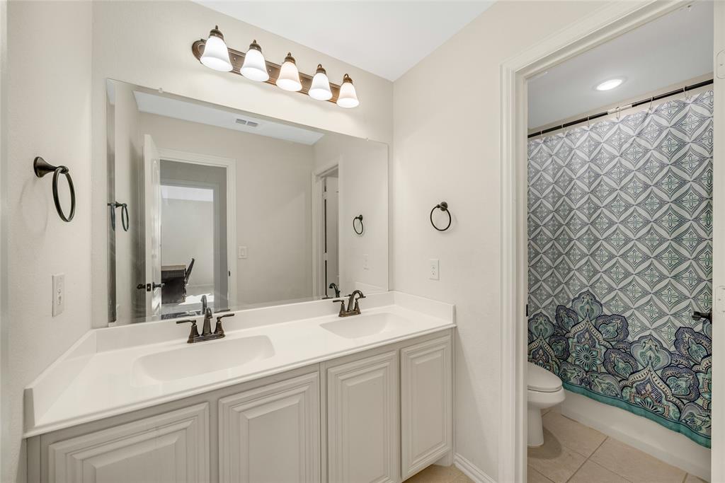 2203 Vista Ridge Road Melissa, TX 75454 - Photo 23 of 40 Bathroom featuring double vanity and light tile patterned floors