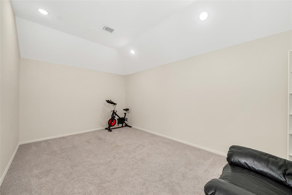 2203 Vista Ridge Road Melissa, TX 75454 - Photo 25 of 40 Sitting room with light colored carpet, recessed lighting, and vaulted ceiling