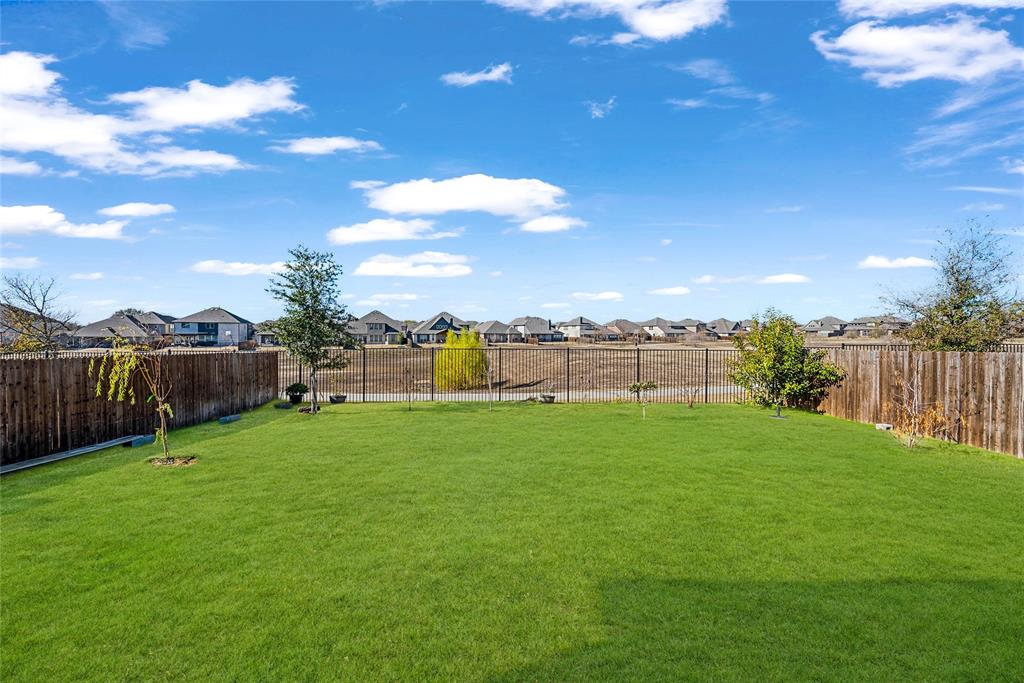 2203 Vista Ridge Road Melissa, TX 75454 - Photo 28 of 40 Fenced backyard with a residential view