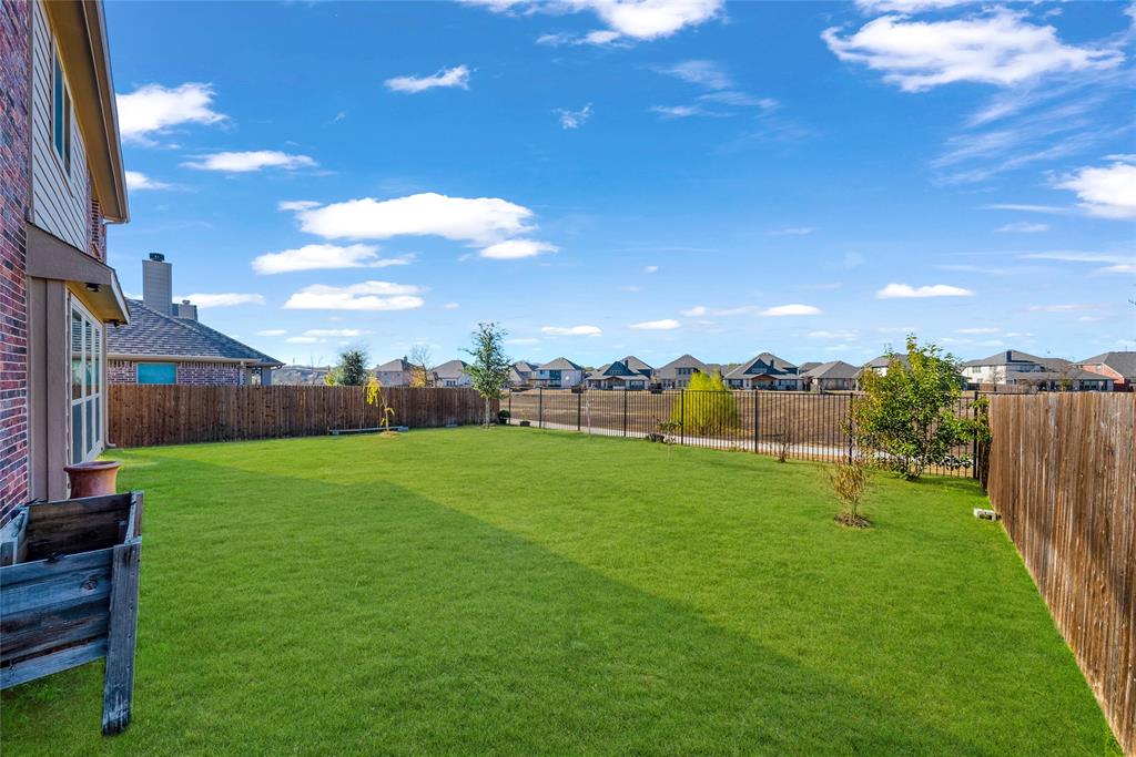 2203 Vista Ridge Road Melissa, TX 75454 - Photo 29 of 40 Fenced backyard featuring a residential view