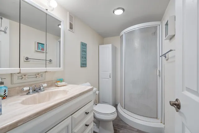 a view of a chair and table in the backyard of the house