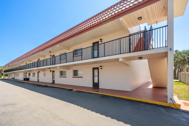 a view of balcony with large windows