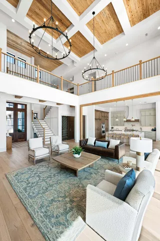 a large white kitchen with a stove a sink and a refrigerator