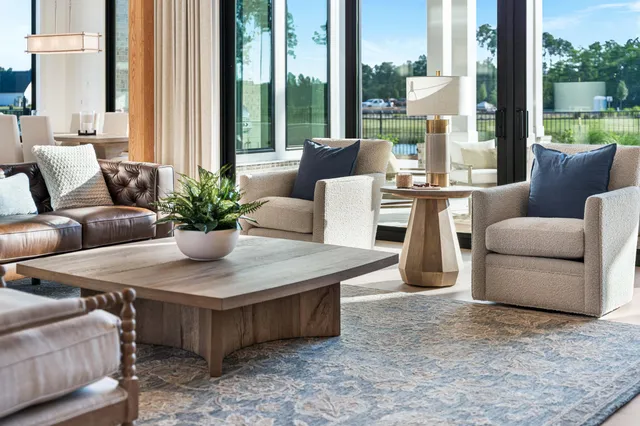 a kitchen with stainless steel appliances granite countertop a stove and a wooden floor