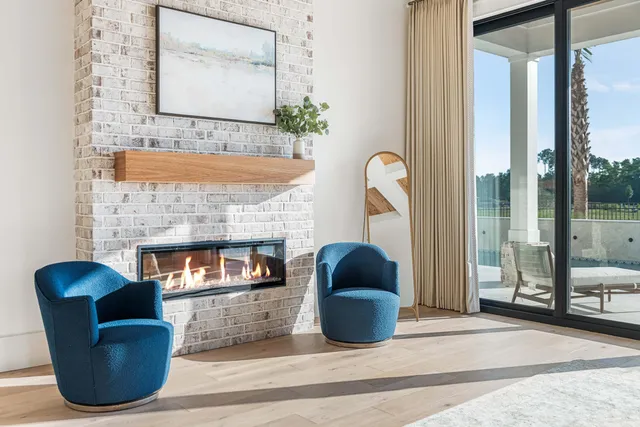 a view of a livingroom with workspace and a window