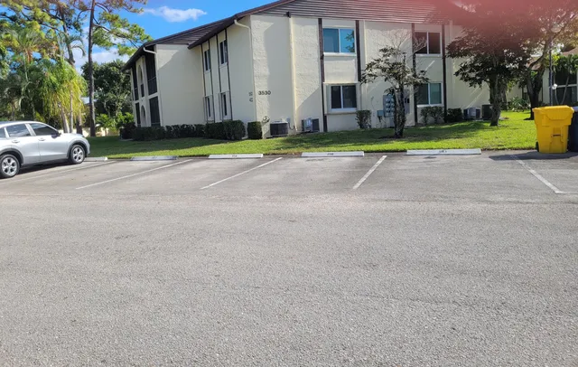 a view of house with garden and entryway