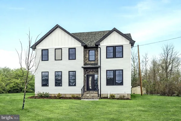 a front view of house with a yard
