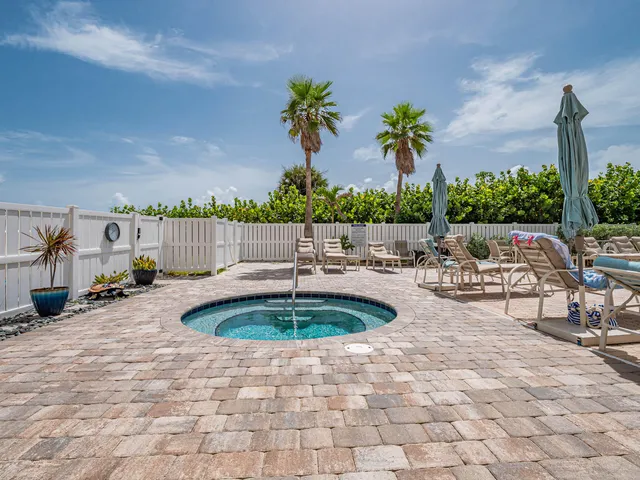 a view of a swimming pool with an outdoor space and seating